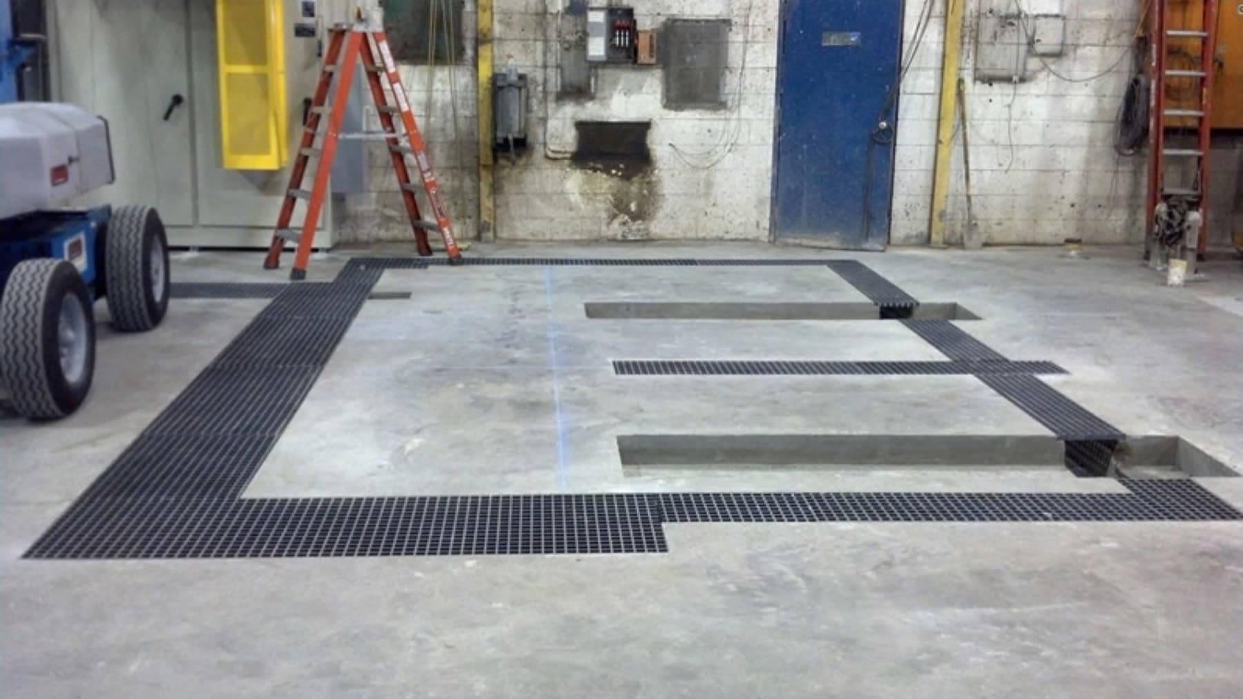 Finished corrugator floor drains with steel grating installed